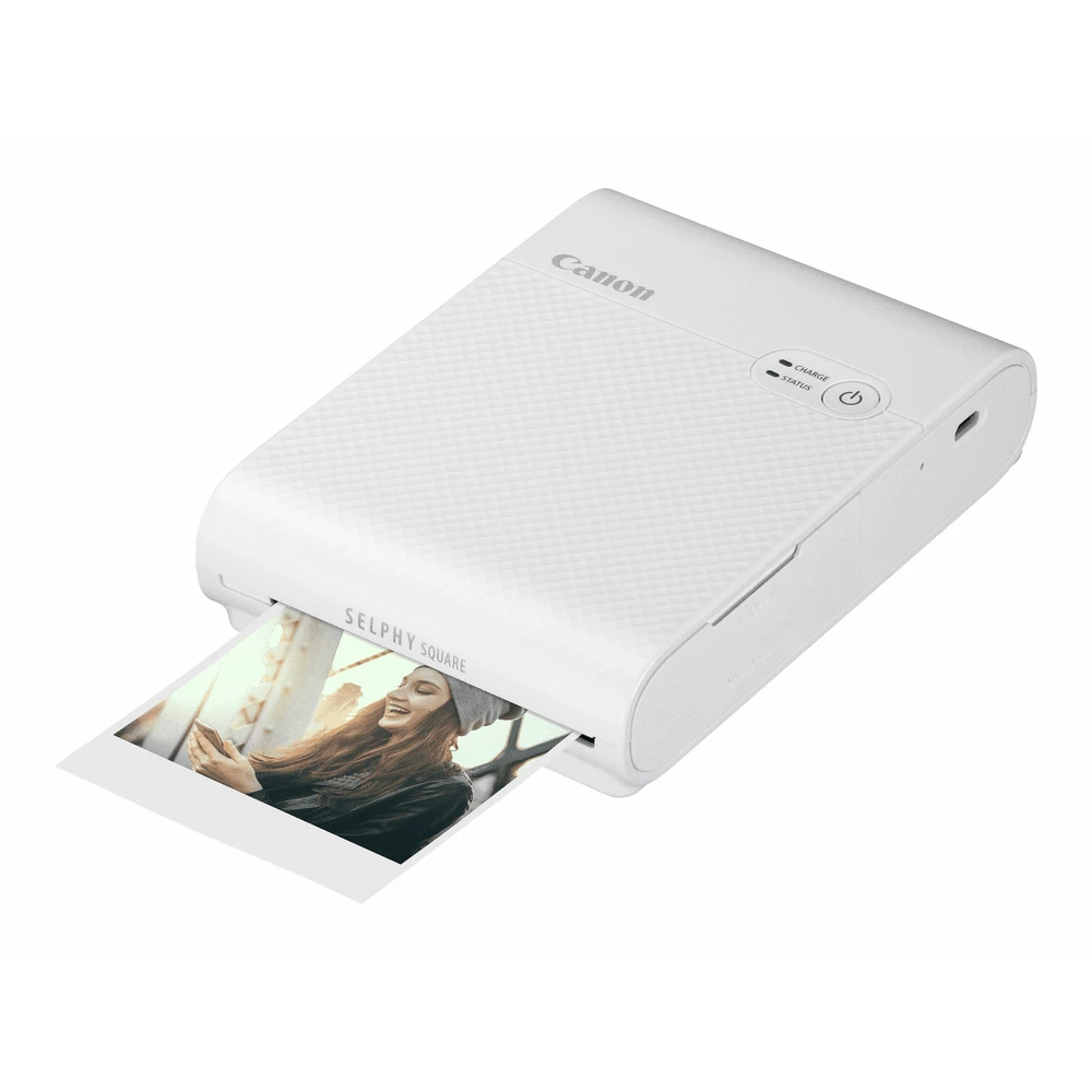 prca-qx10weiss-2e34792e9bc9991a54a692e2a636e0d6-184202-1-51aee632d2a56655921452a85e38c723 Canon Selphy Square Qx10 Weiss - Image 1